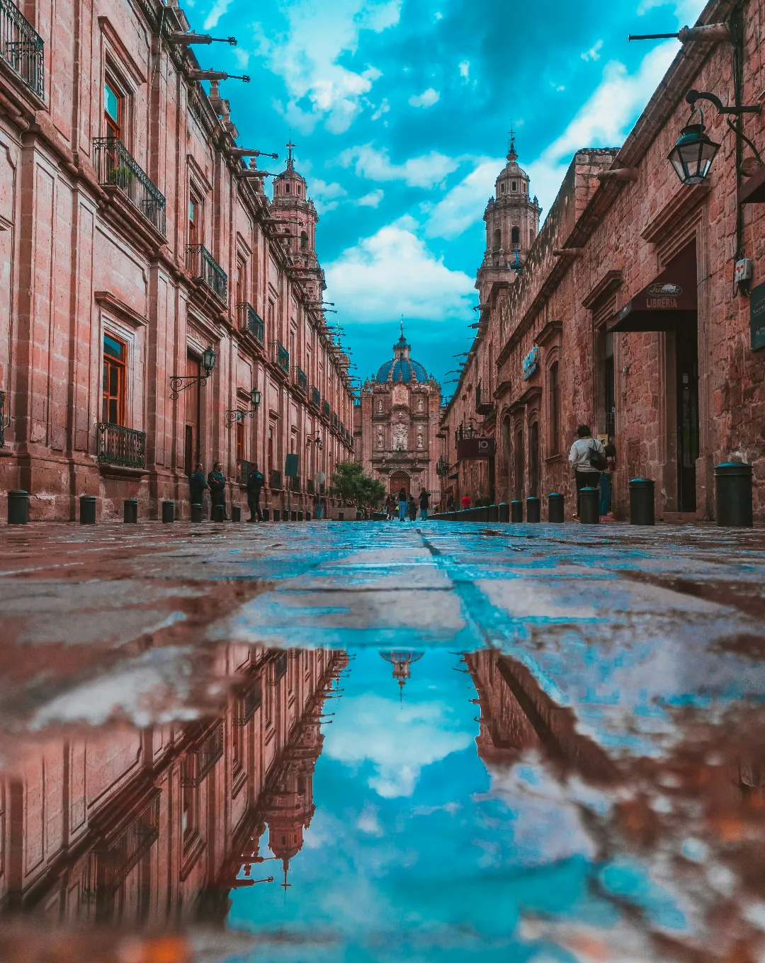 Colonial street reflected after rain in Mexico