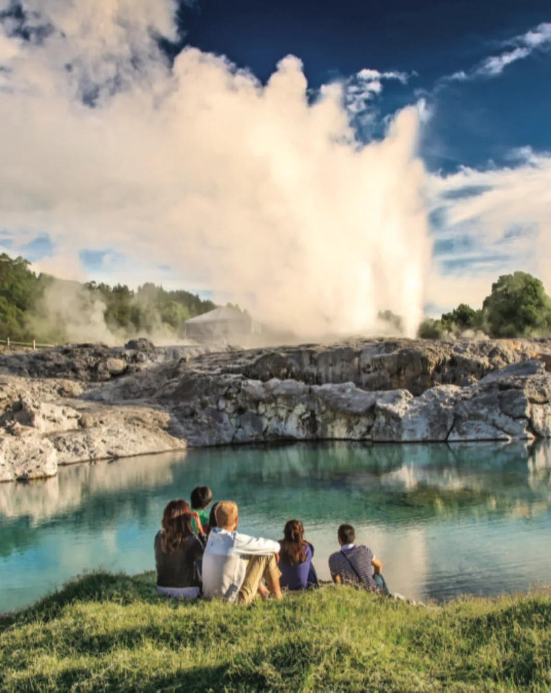 Geyser erupting beside visitors in Rotorua