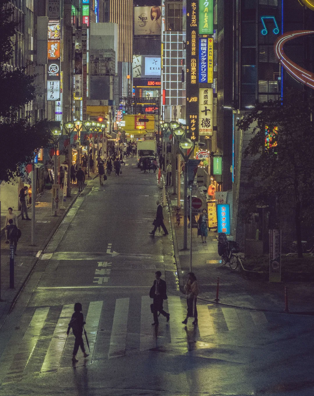 Neon-lit street at night in Tokyo