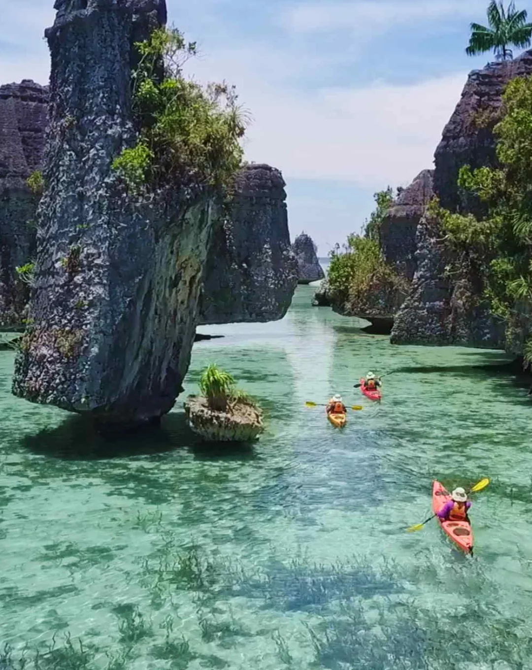 Kayaks between limestone islets in Indonesia